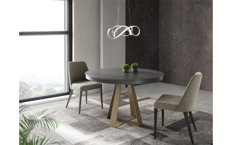 Mesa redonda extensible de comedor con diseño moderno tapa porcelánico modelo Delia de Indesan